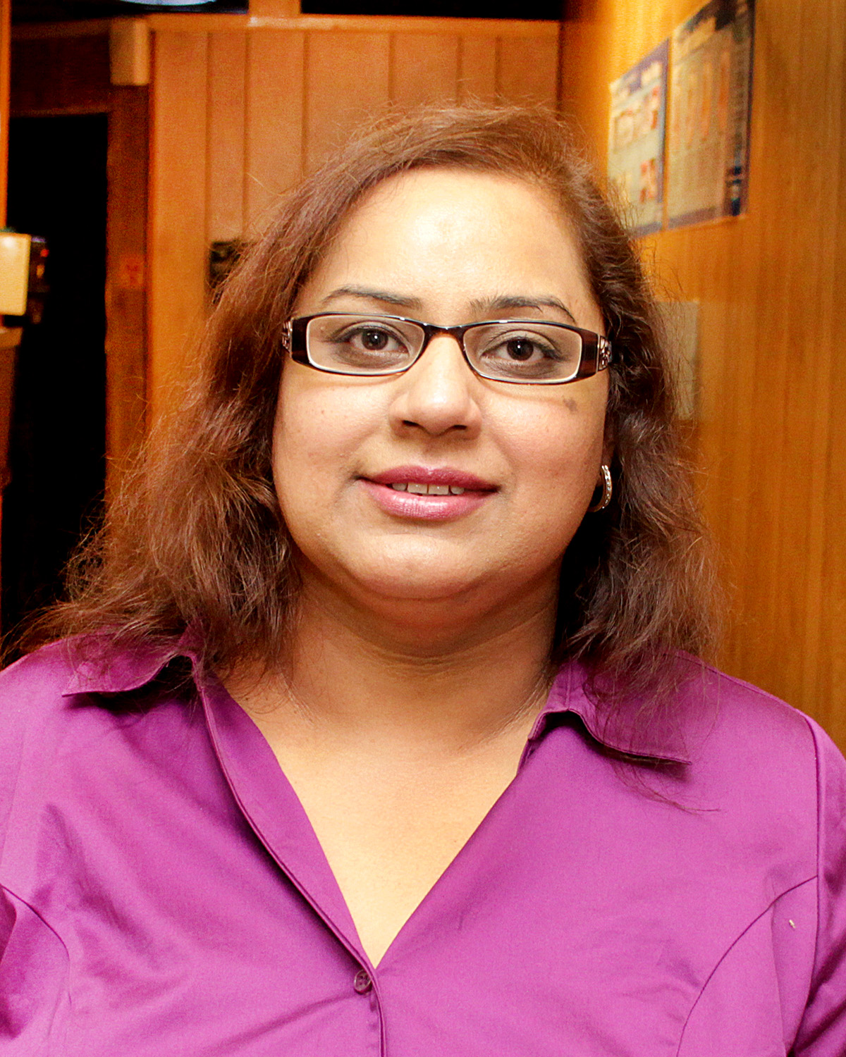 Dr. Saima Mian, DMD, smiling in her dental office